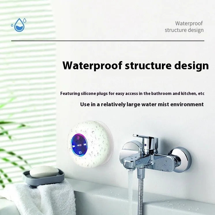 Large white waterproof Bluetooth speaker with a suction cup base and built-in LED light
