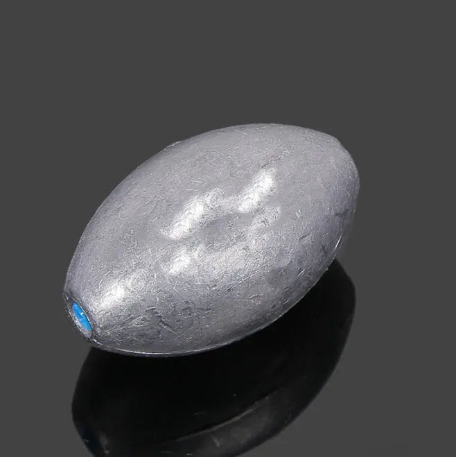 Tongxin olive-shaped lead fishing sinker with scale texture and internal plastic core.