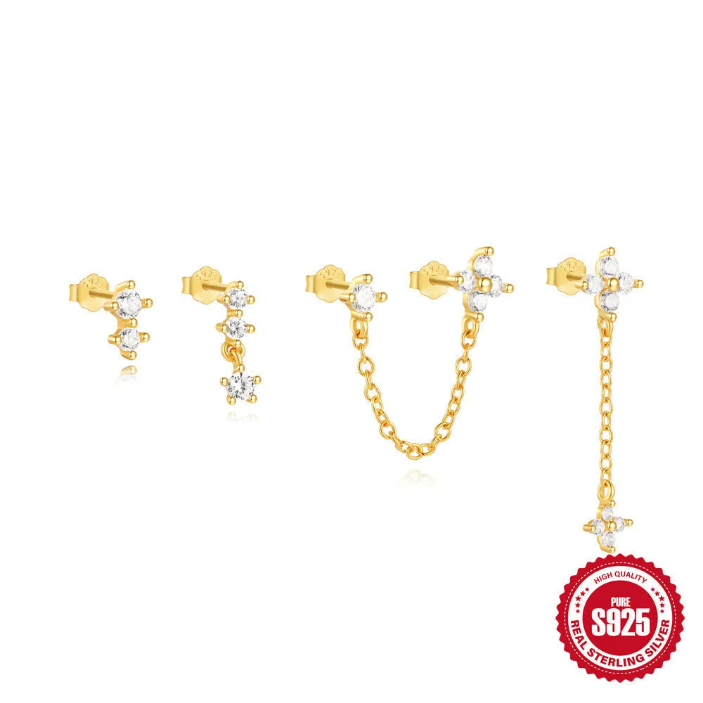A pair of S925 sterling silver earrings with a geometric clover petal design and an electroplated gold finish.