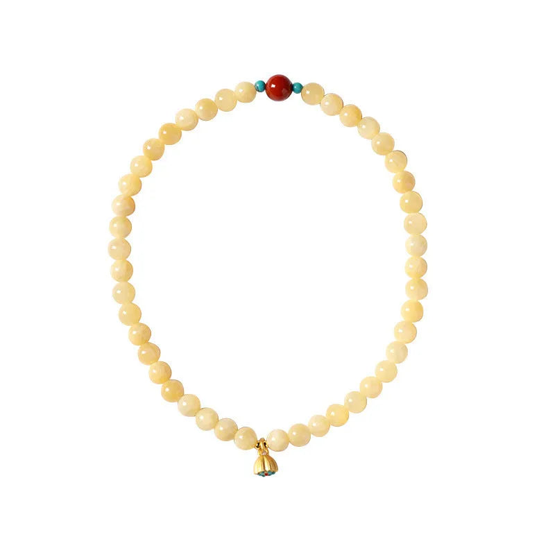 Yellow jade double ring bracelet with lotus seedpod design in hand-woven construction