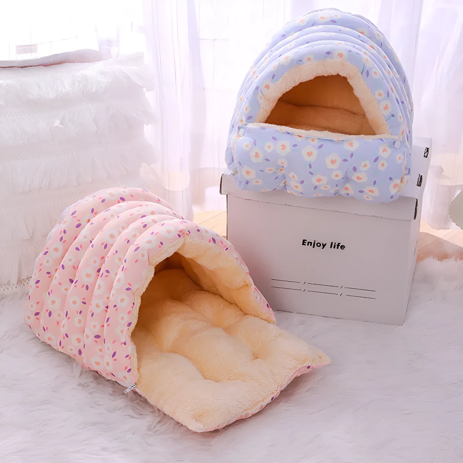 Enclosed winter cat bed with a removable cover in a floral pattern, shown in small and medium sizes.