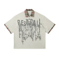 Men's loose asymmetric short-sleeve top with a lapel graffiti print in cotton.