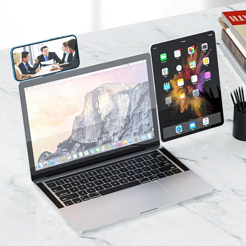 Black aluminium laptop phone holder mounted to computer monitor with smartphone attached