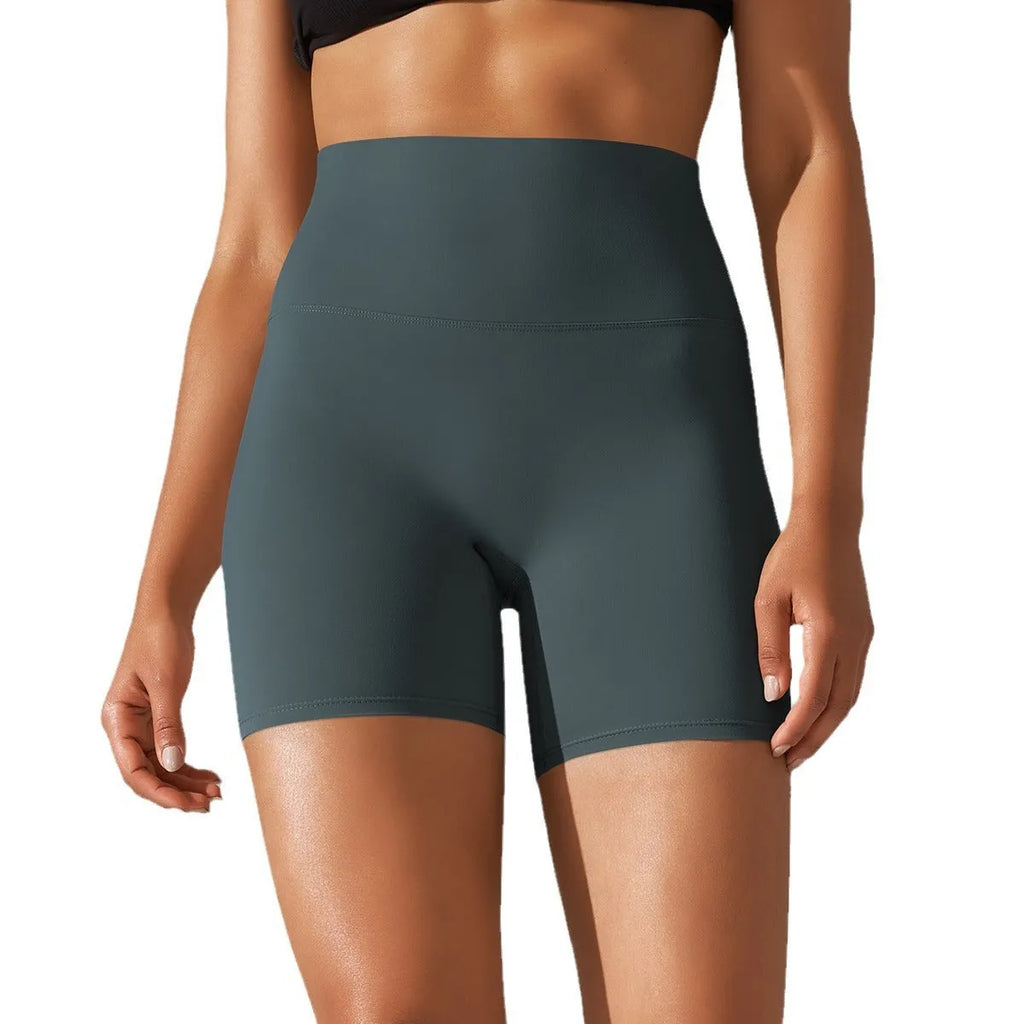 Women's high waist fitness tights in dark green colour with hip lift design for workout and daily wear