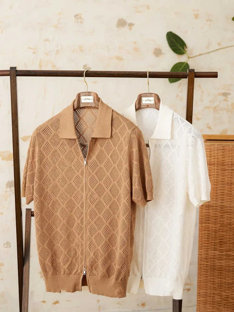 Light brown cotton short sleeve cardigan with front zipper and lapel collar laid flat.