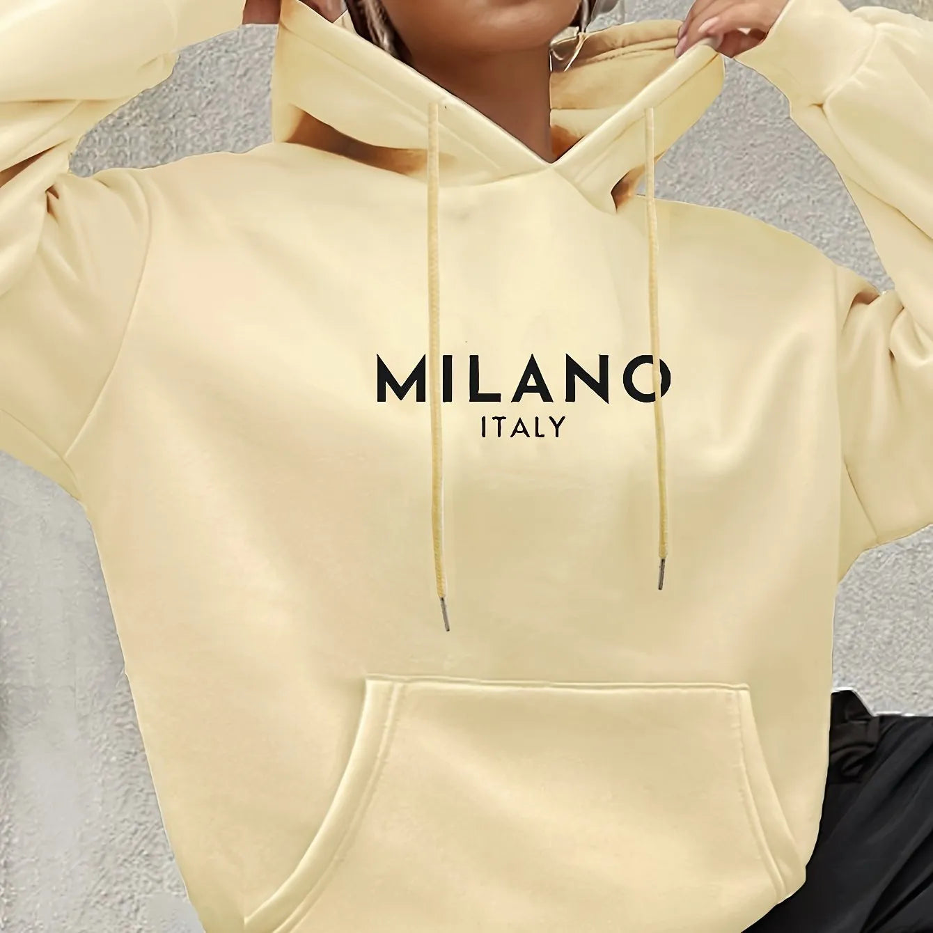Casual long sleeved printed kangaroo pocket hoodie in black, loose fit, front view