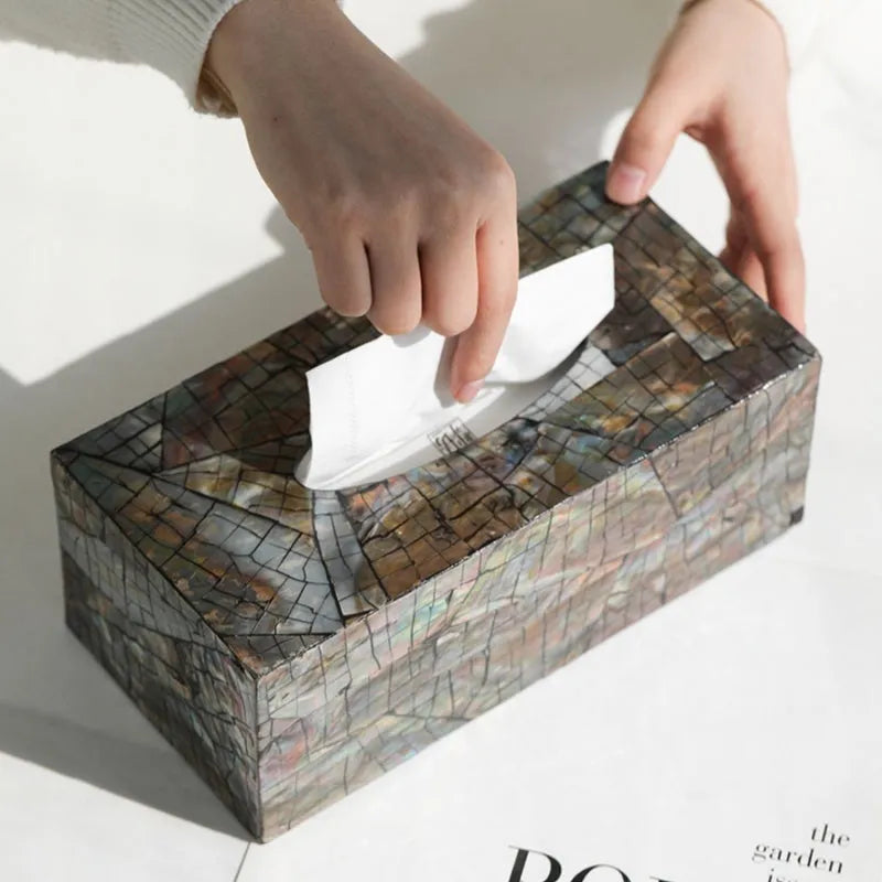 Natural shell decorative storage box tissue holder in square and rectangular shapes on a table.