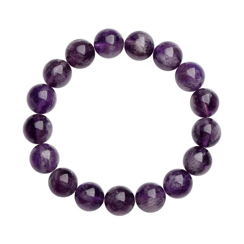 Snow Mountain Feather Amethyst crystal bracelet with scattered geometry beads and Ruyi design on a wrist.