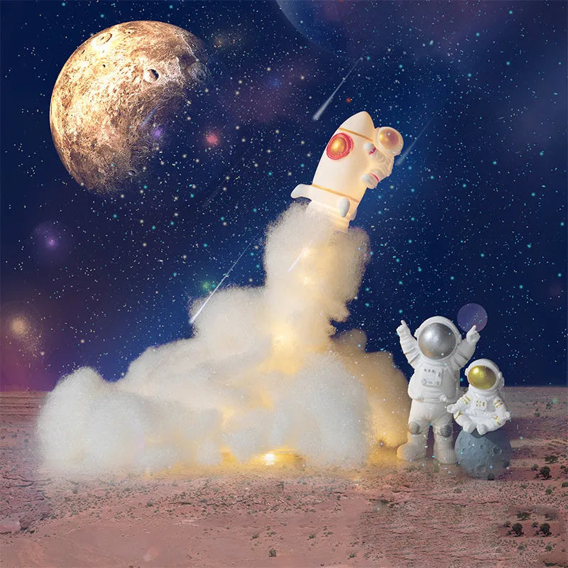 DIY astronaut rocket night light kit components including rocket model, LED string lights, chassis and assembly materials