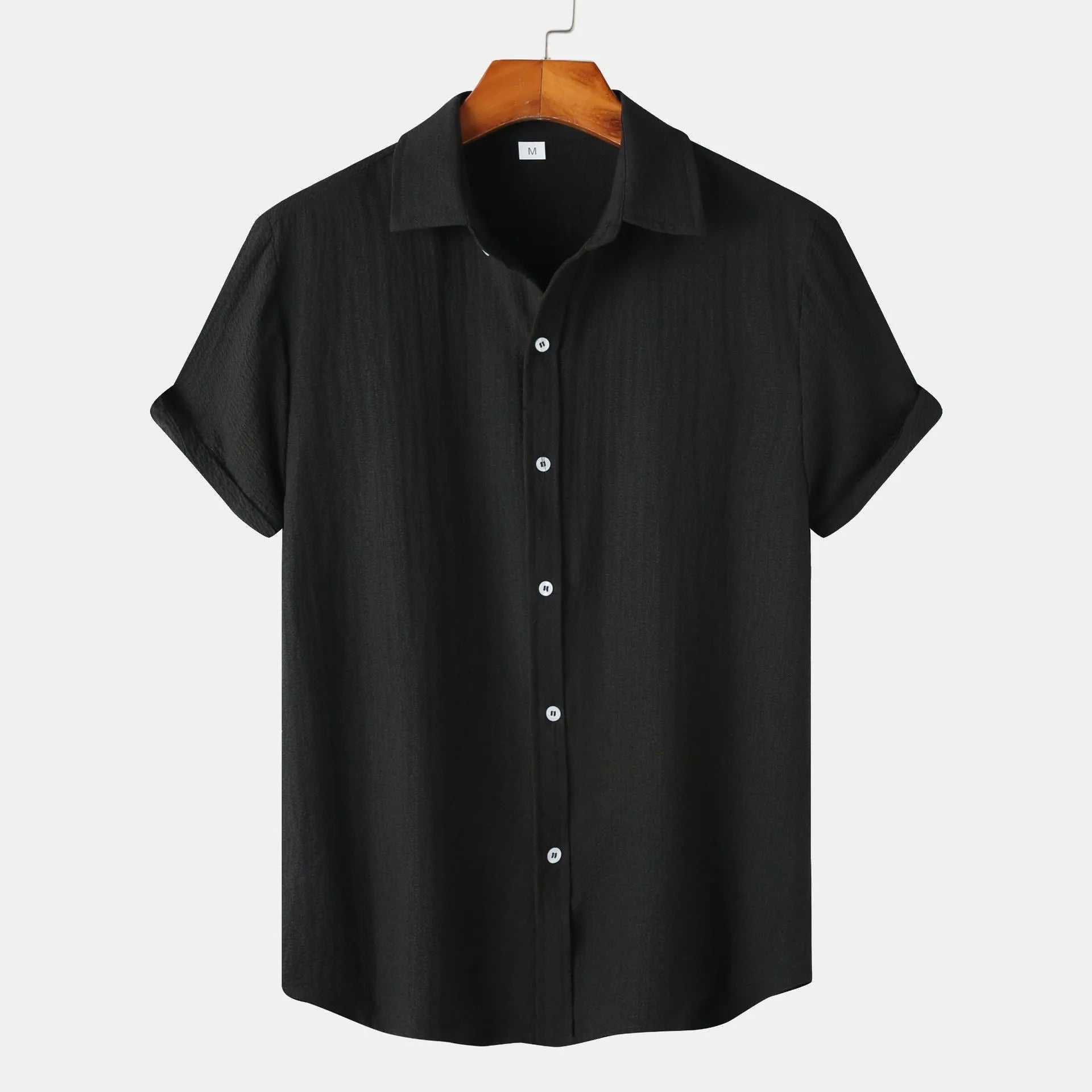 Man wearing a casual short-sleeve polyester shirt in a cardigan style, available in various colours and sizes.