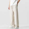 Men's beige bamboo fibre linen trousers with a straight leg, cropped length, and drawstring waist.