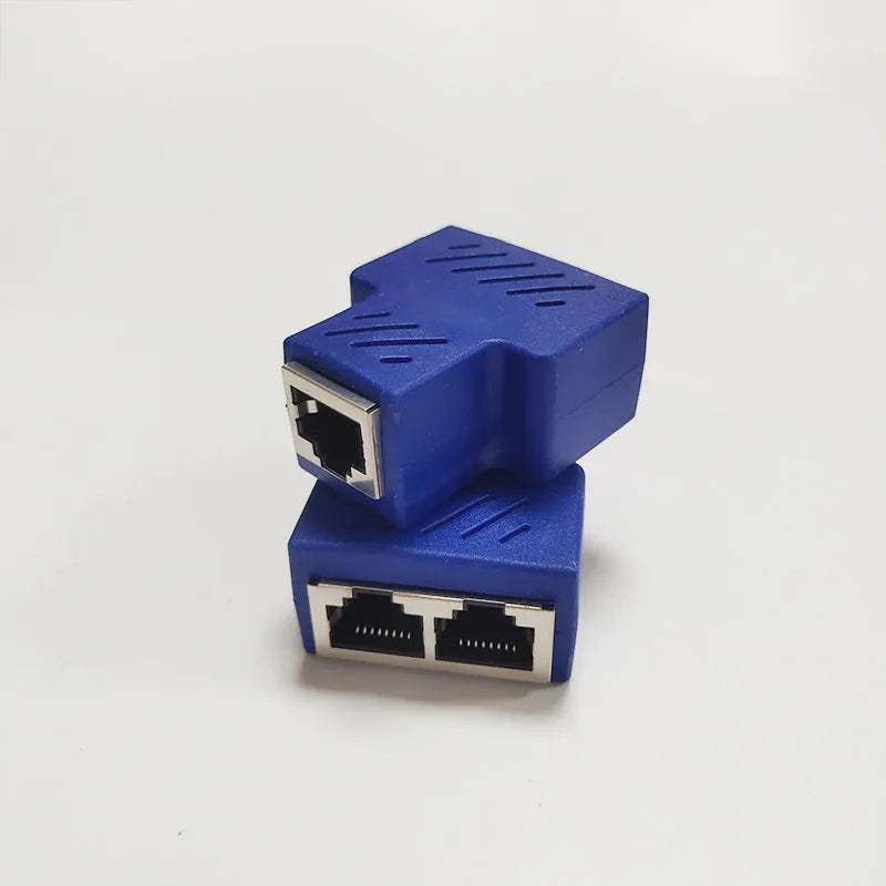 White RJ45 three-way network cable splitter adapter on a black background.