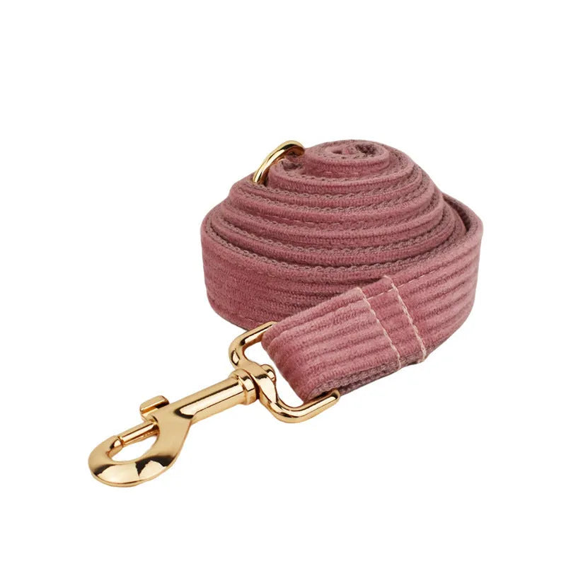 Corduroy dog collar and leash set with matching red bow, vest, and poop bag holder for small to large dogs.