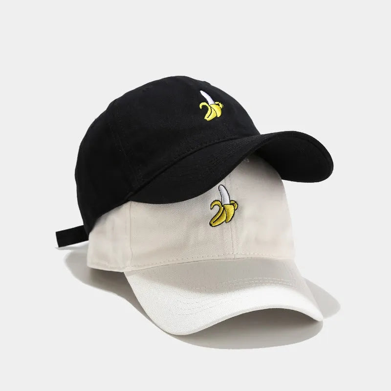 Adjustable baseball cap with cute banana embroidery in seven colour options on soft polyester fabric