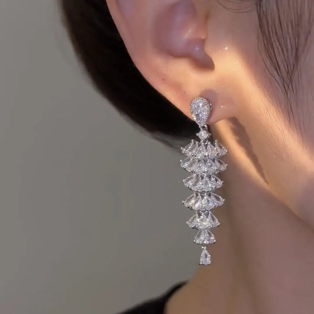 Silver pagoda colour Christmas tree drop earrings with zircon stones on copper stud setting.