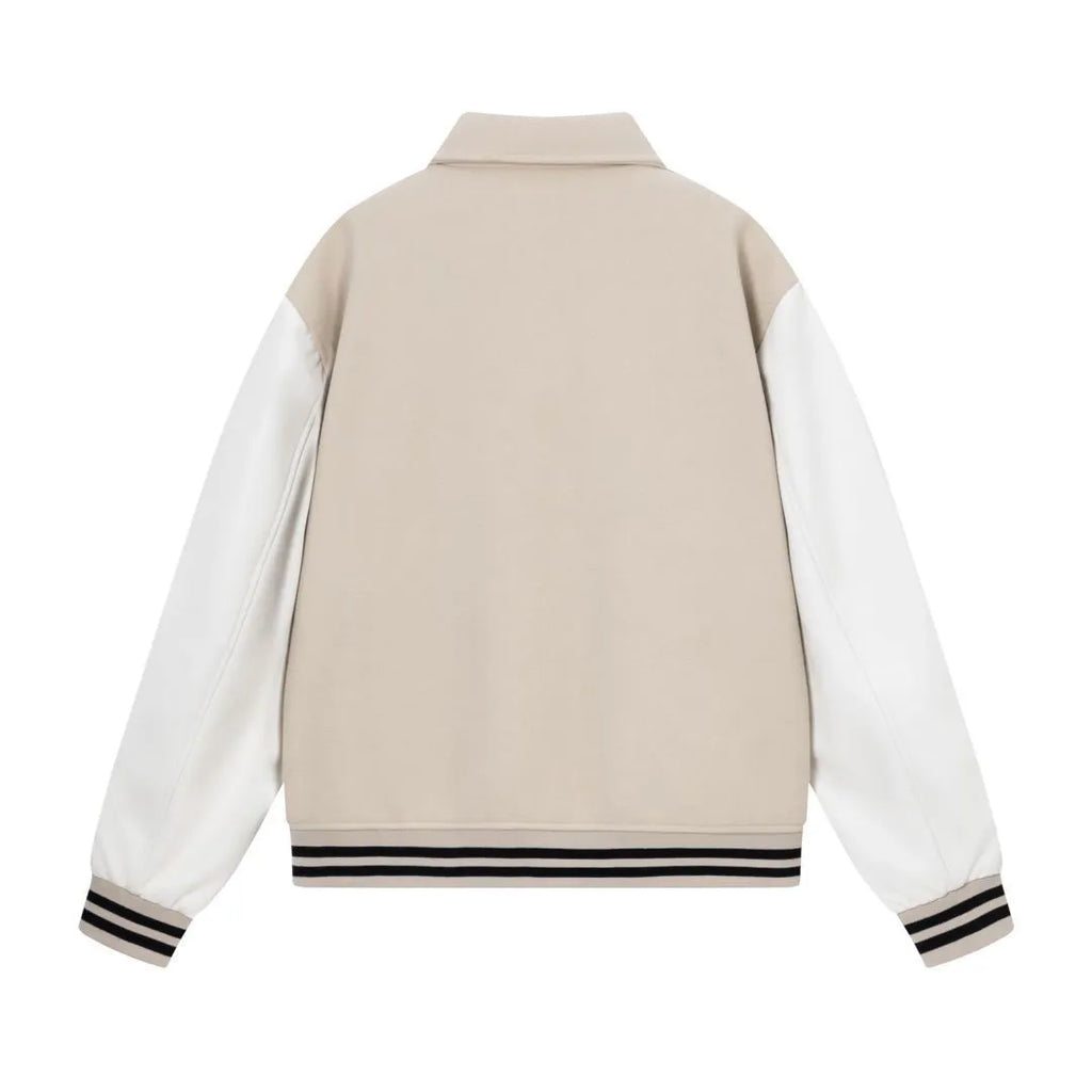 Women's apricot wool jacket with bone embroidery on the front, showing casual fit and stitch detail.