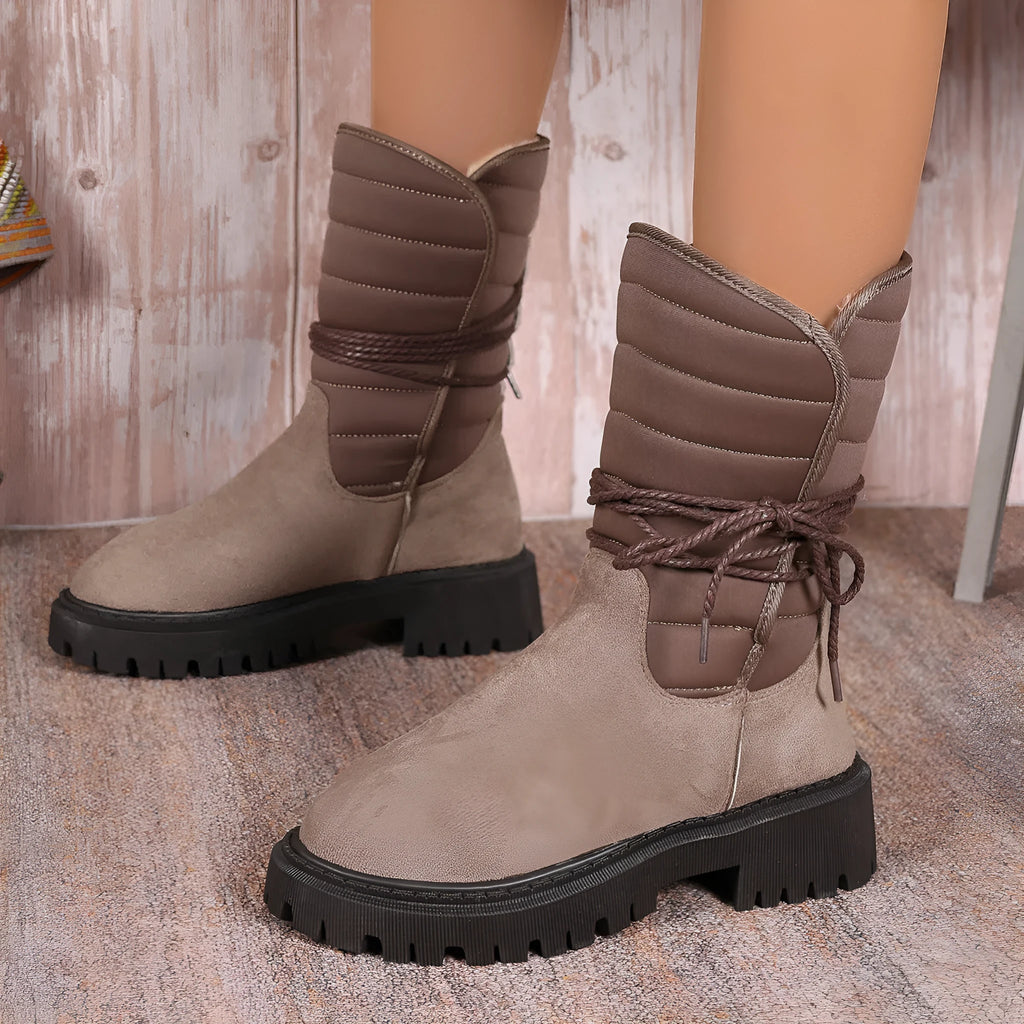 Women's black suede chunky heel mid-calf snow boot with lace-up front and fleece lining.