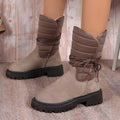 Women's black suede chunky heel mid-calf snow boot with lace-up front and fleece lining.