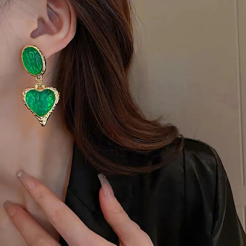 Oval love heart stud earrings with silver needle pleating in four colour options