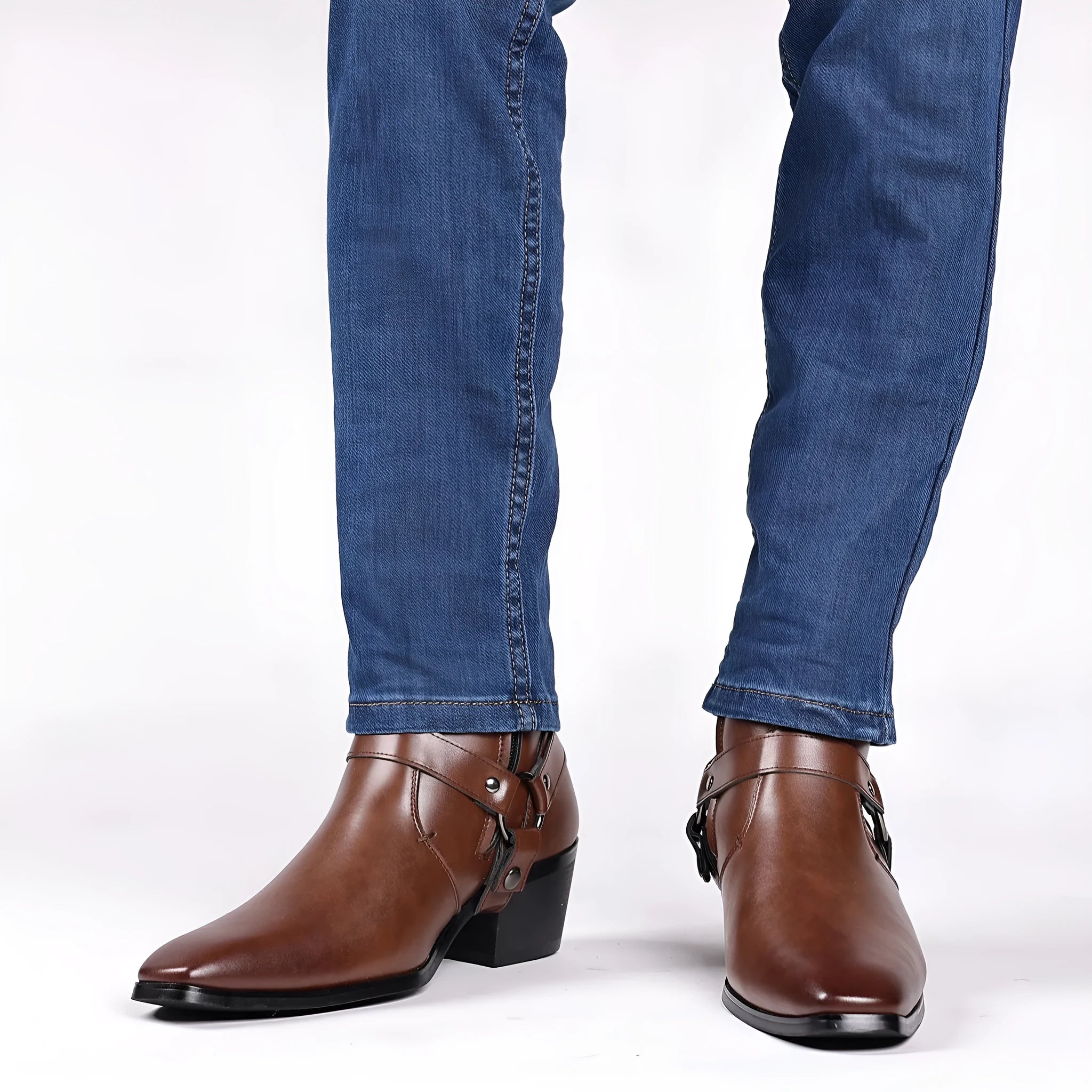 Side view of a black unisex boot with a square toe, side zip, and decorative rivets on a block heel.