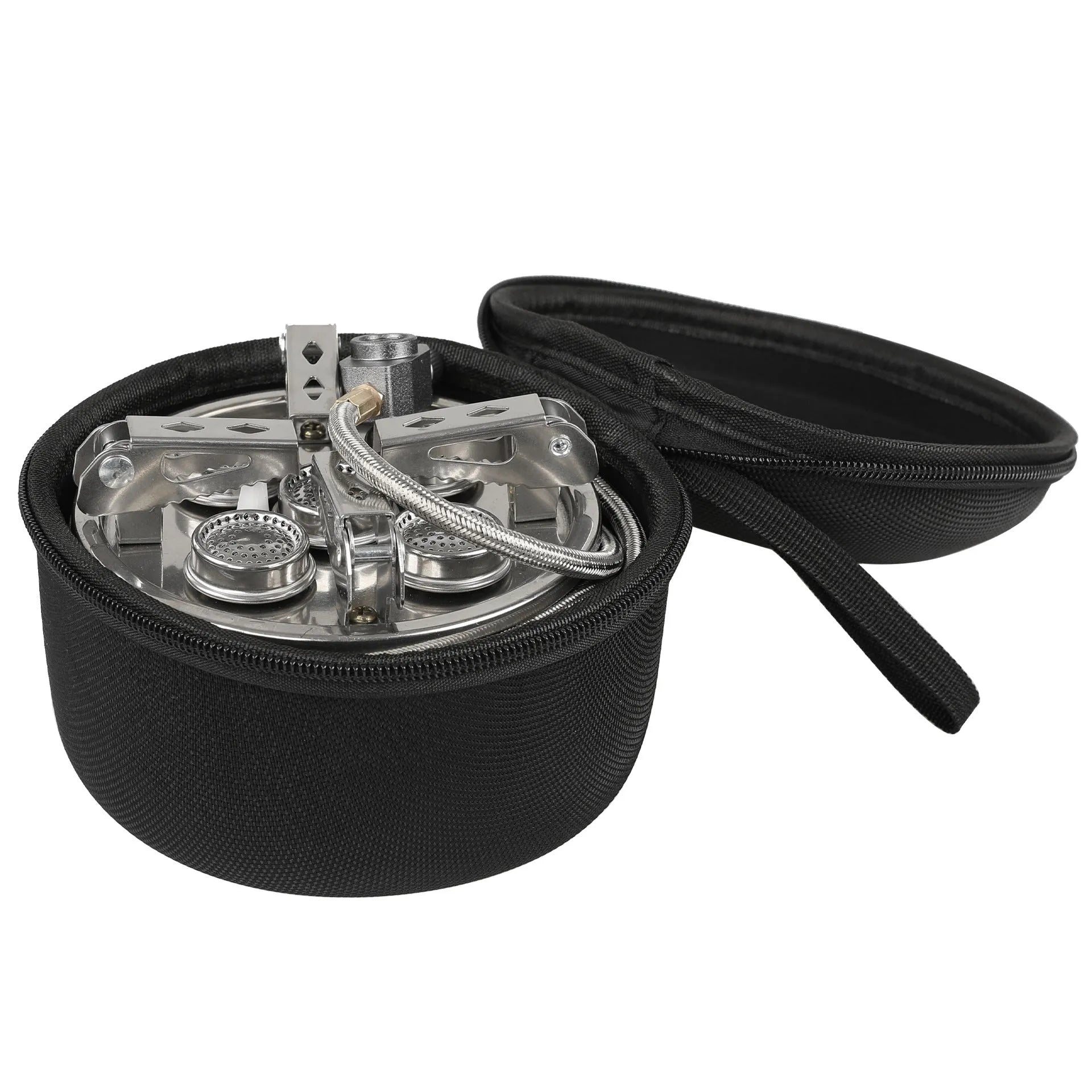 Silver portable split camping stove with foldable legs and a long black hose, on a grass background.