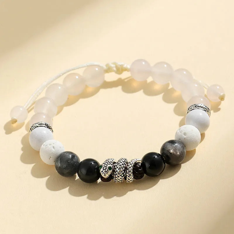 Black and white agate couple bracelets with snake clasps, turquoise accents, and glitter beads