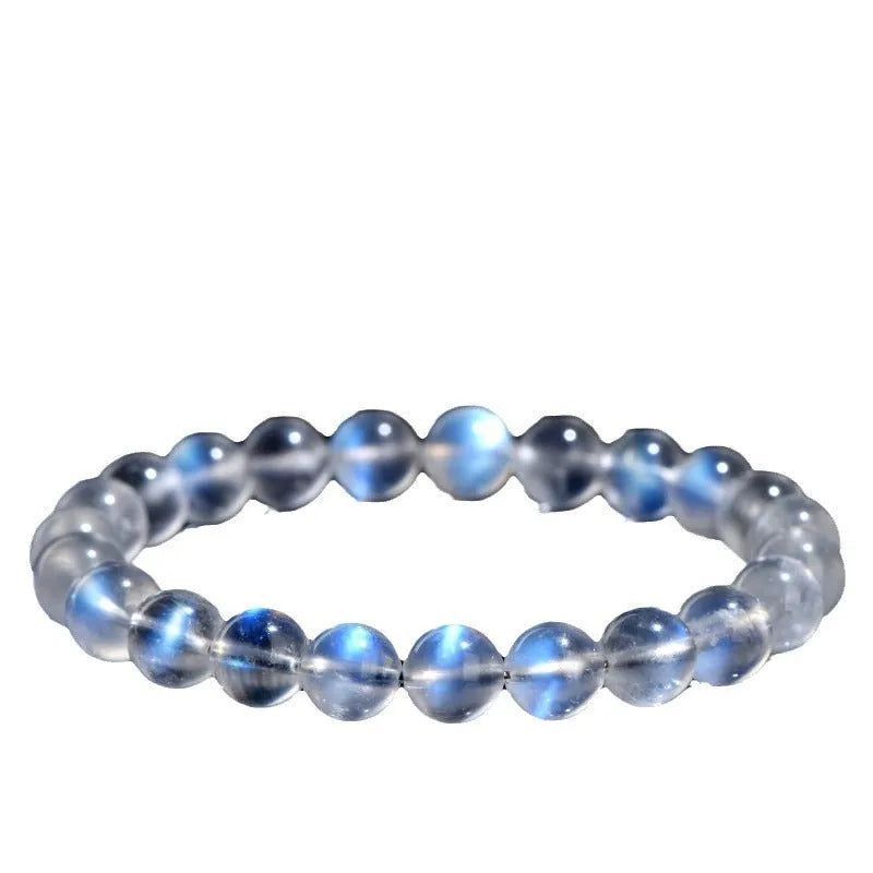 Natural cream body blue moonlight crystal bracelet on a white background showing grinding finish.