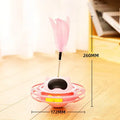 Pink cat stick toy with rotating tumbler turntable measuring 17cm by 10cm