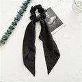 Large intestine ring hair bandeau with floral ribbon design in cloth material