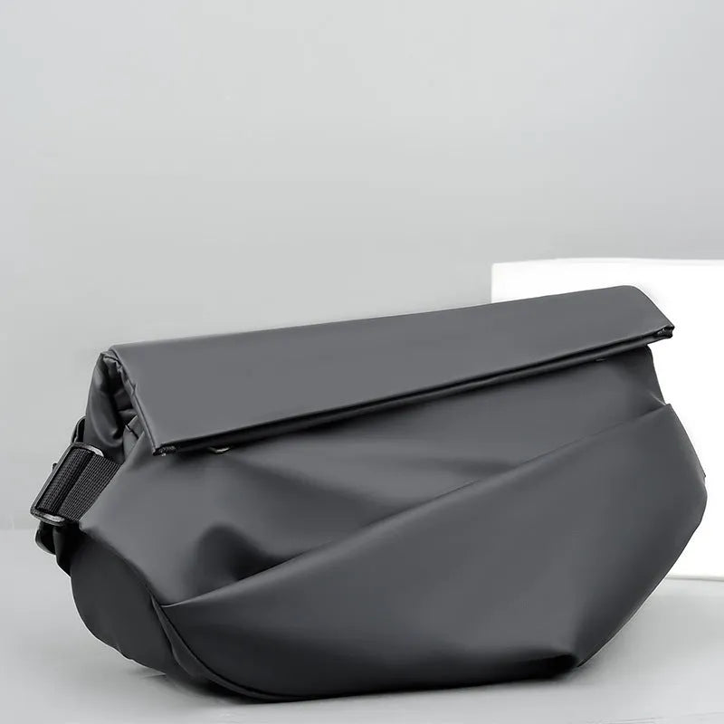 Grey PU leather men's crossbody sling backpack with zip and adjustable strap.