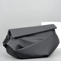 Grey PU leather men's crossbody sling backpack with zip and adjustable strap.