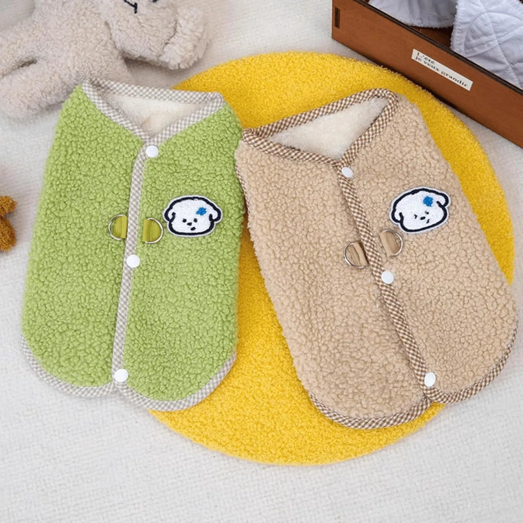 Green coral fleece dog vest with a leash ring on a small dog, showing the sleeveless design.