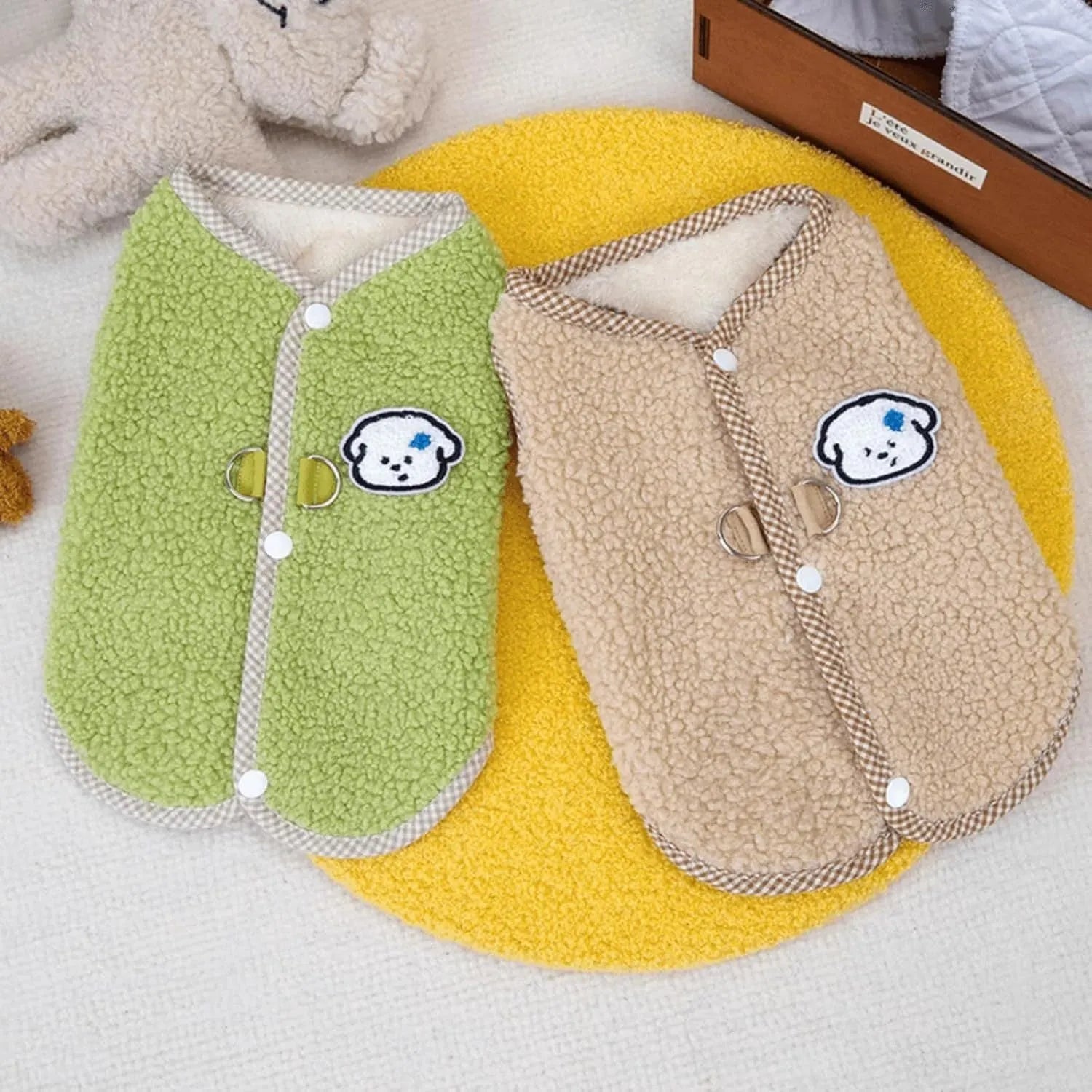 Green coral fleece dog vest with a leash ring on a small dog, showing the sleeveless design.