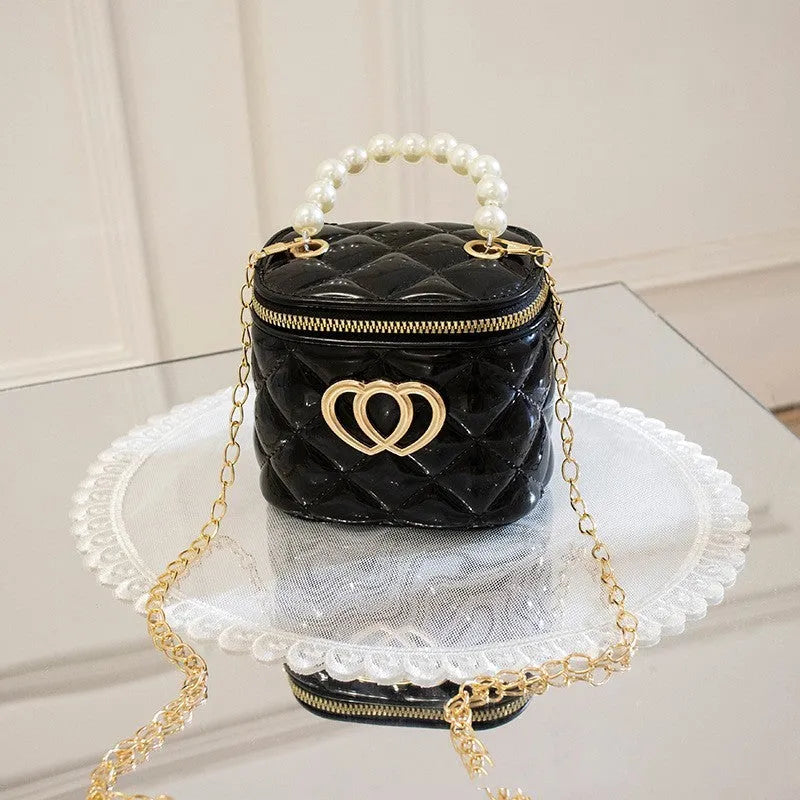 Women's PVC bucket gel bag with heart-shaped pattern in assorted colours.