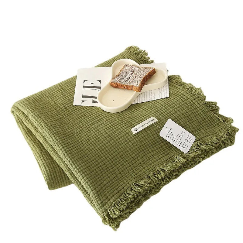 Four-layer gauze cotton blanket with edge tassels in a choice of ten colours and two sizes.