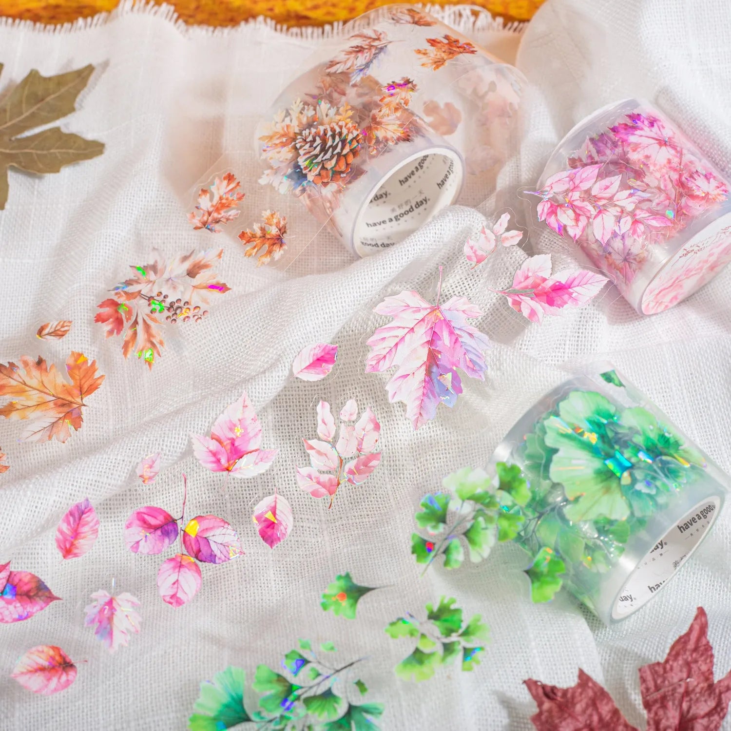 Roll of PET decorative stickers showing leaf patterns including ginkgo and maple designs, 40mm wide