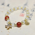Chinese style women's coloured glass bracelet with safety lock and windmill charms