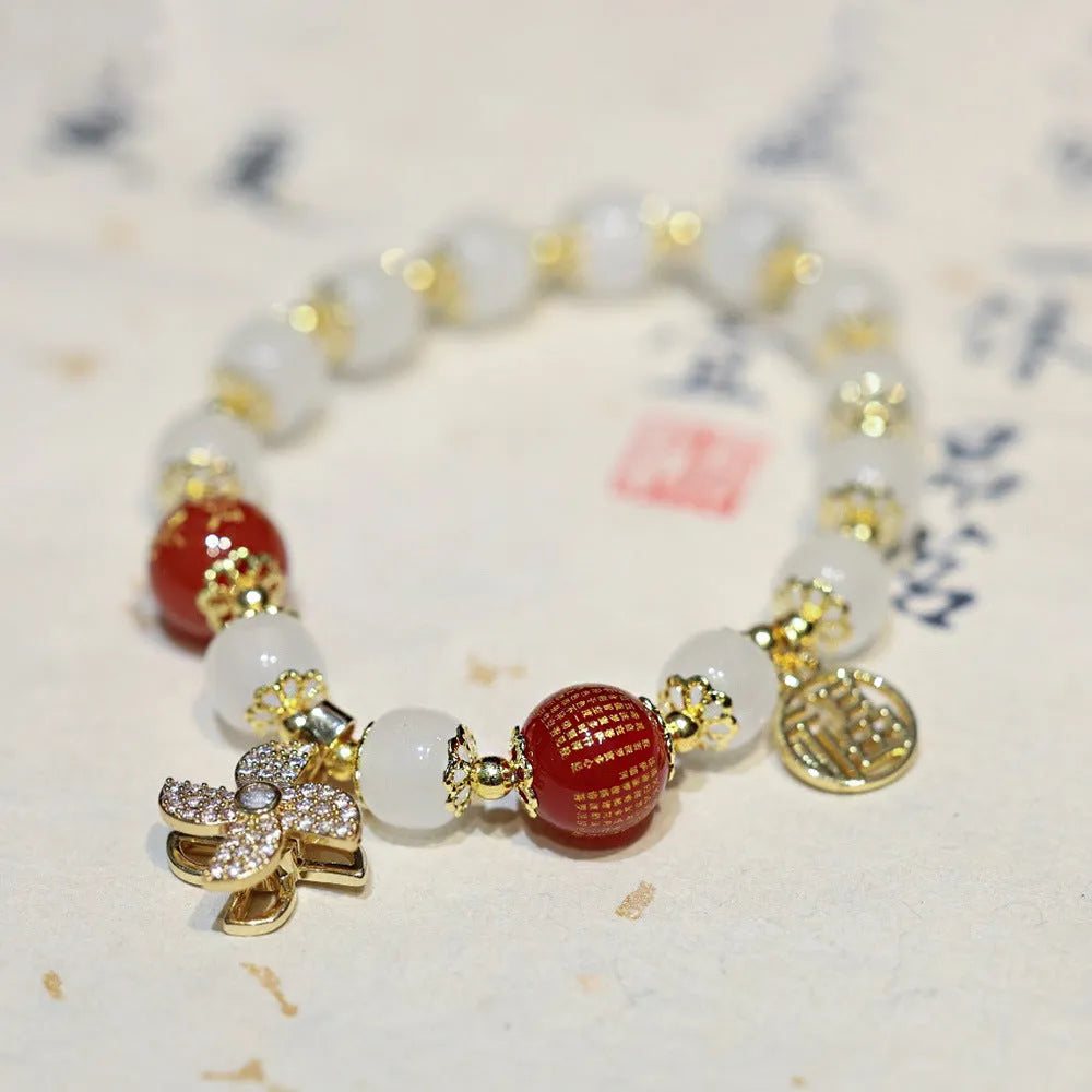 Chinese style women's coloured glass bracelet with safety lock and windmill charms