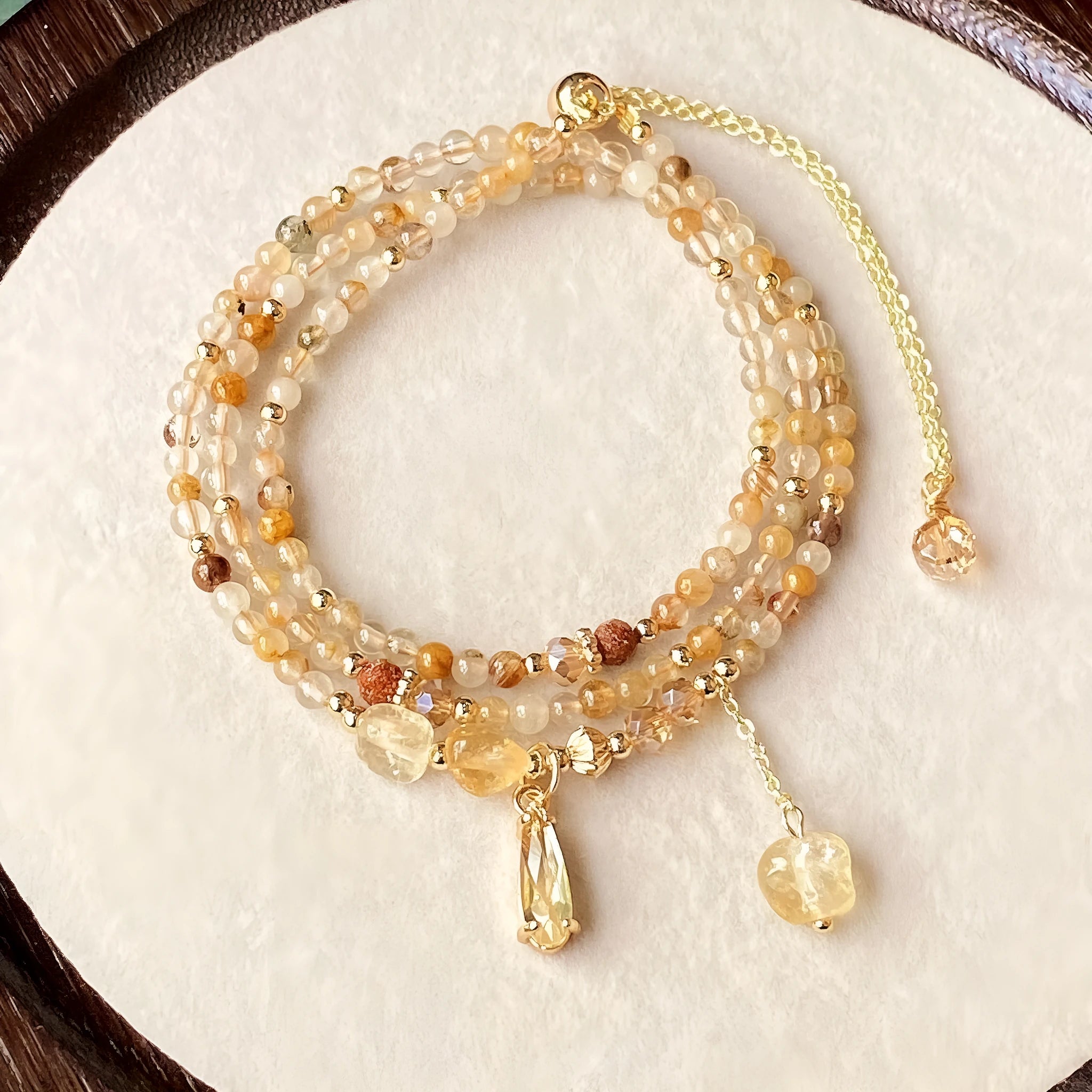 Women's multi-layer bracelet with caramel citrine stones and gold electroplated three-circle design