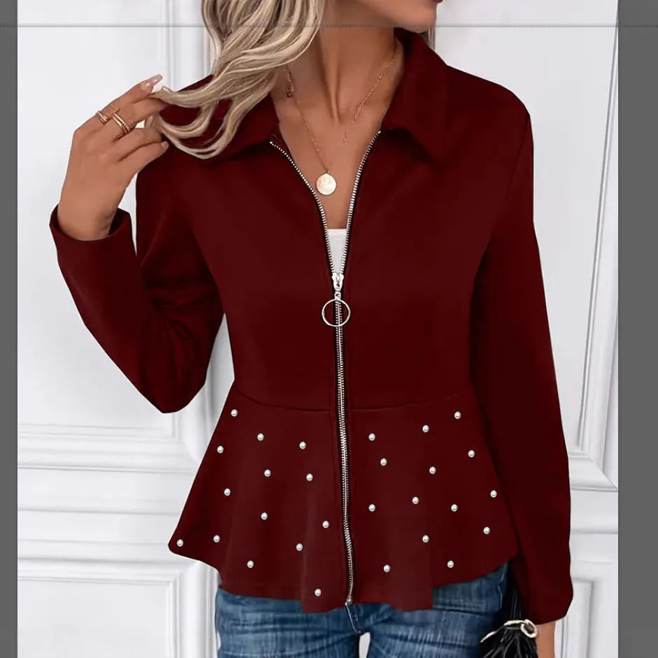 Women's black loose fit coat with a heavy-duty beaded zipper and a ruffled hem.