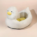 Blue duck-shaped fluffy pet bed sofa for a small dog, showing raised sides and soft material.