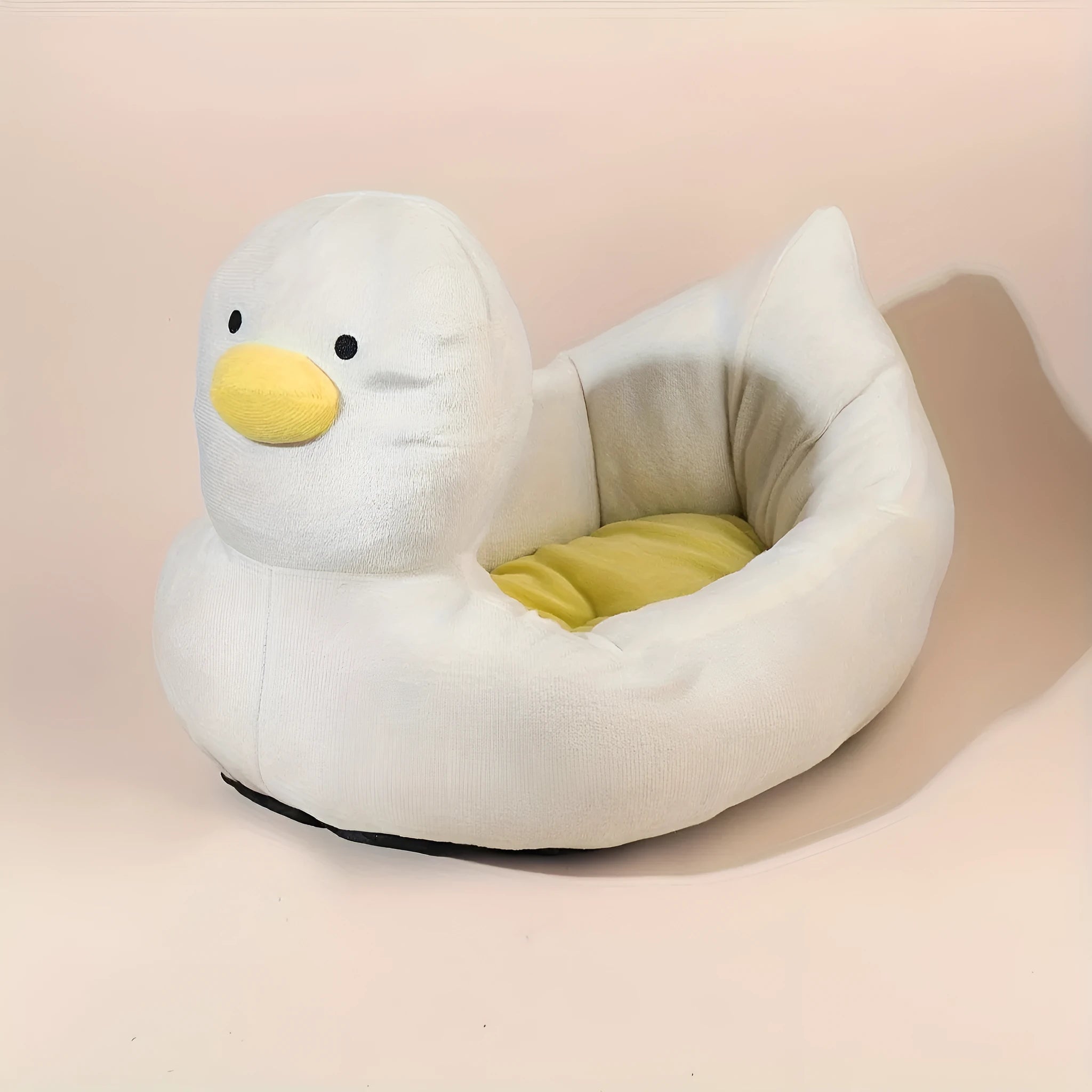 Blue duck-shaped fluffy pet bed sofa for a small dog, showing raised sides and soft material.