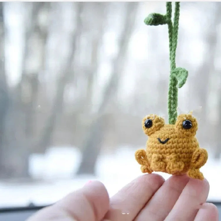 Handmade green plush frog woven pendant for car interior decoration.