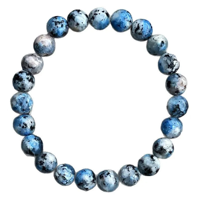 Handmade geometric bracelet made from blue K2 Azurite stone beads on a wrist.