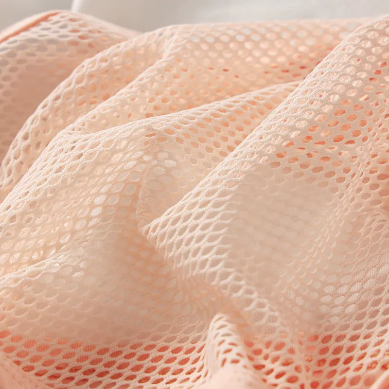 Men's low waist briefs in elastic mesh fabric shown in black, white, pink, blue, and red colours.