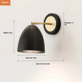 Nordic style iron wall lamp with a metallic shade for bedside or living room.