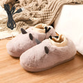 USB electric heating slippers in soft velvet, showing USB cable connection and adjustable temperature controls.
