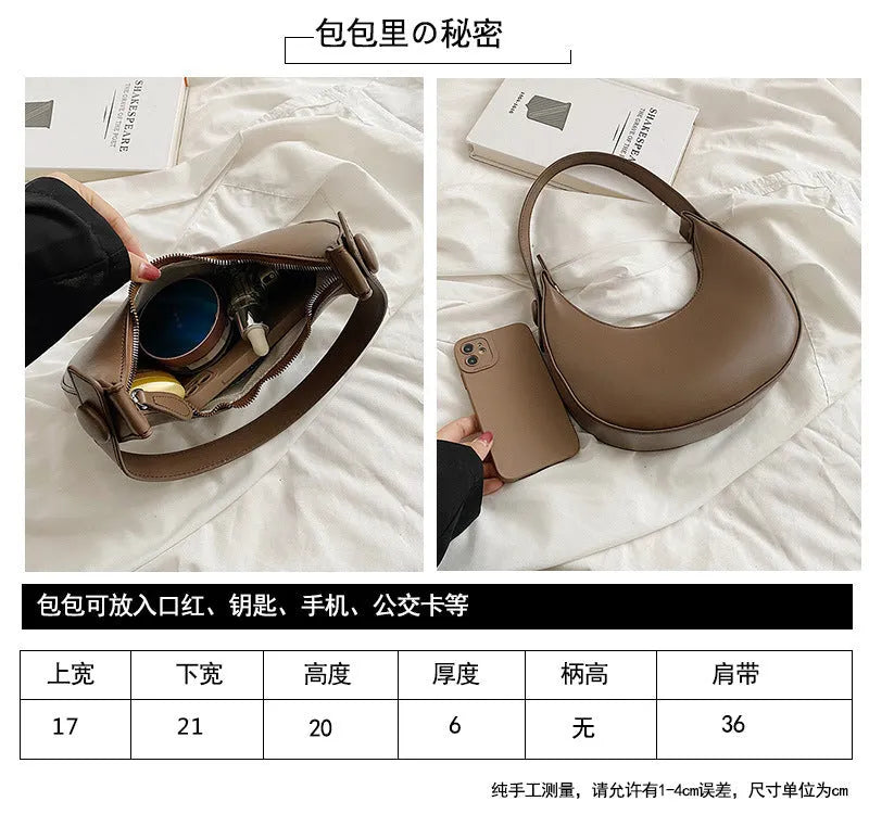 Women's retro-style PU dumpling shoulder bag in black, showing front zipper compartment.