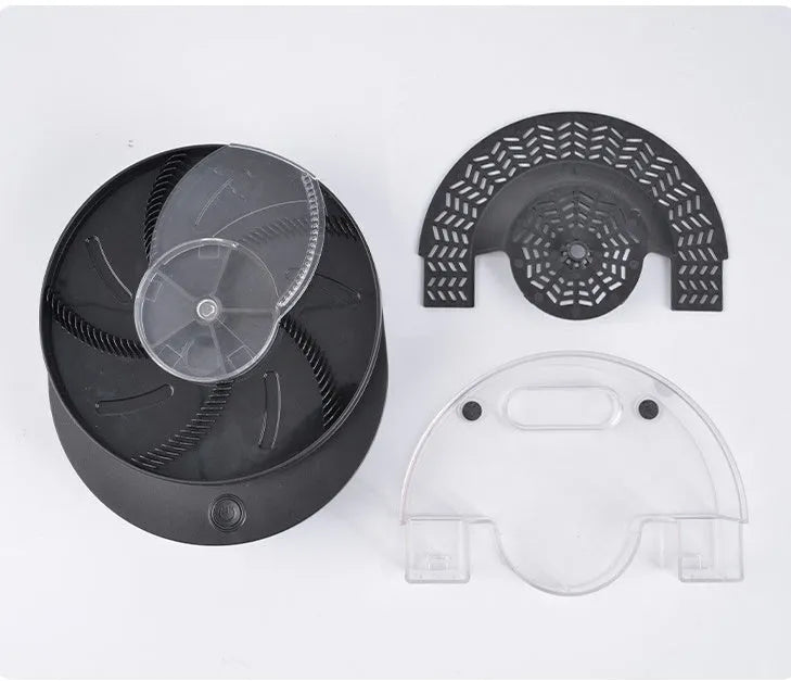 Black and white electric fly trap with USB cable and bait, showing the fly cage.