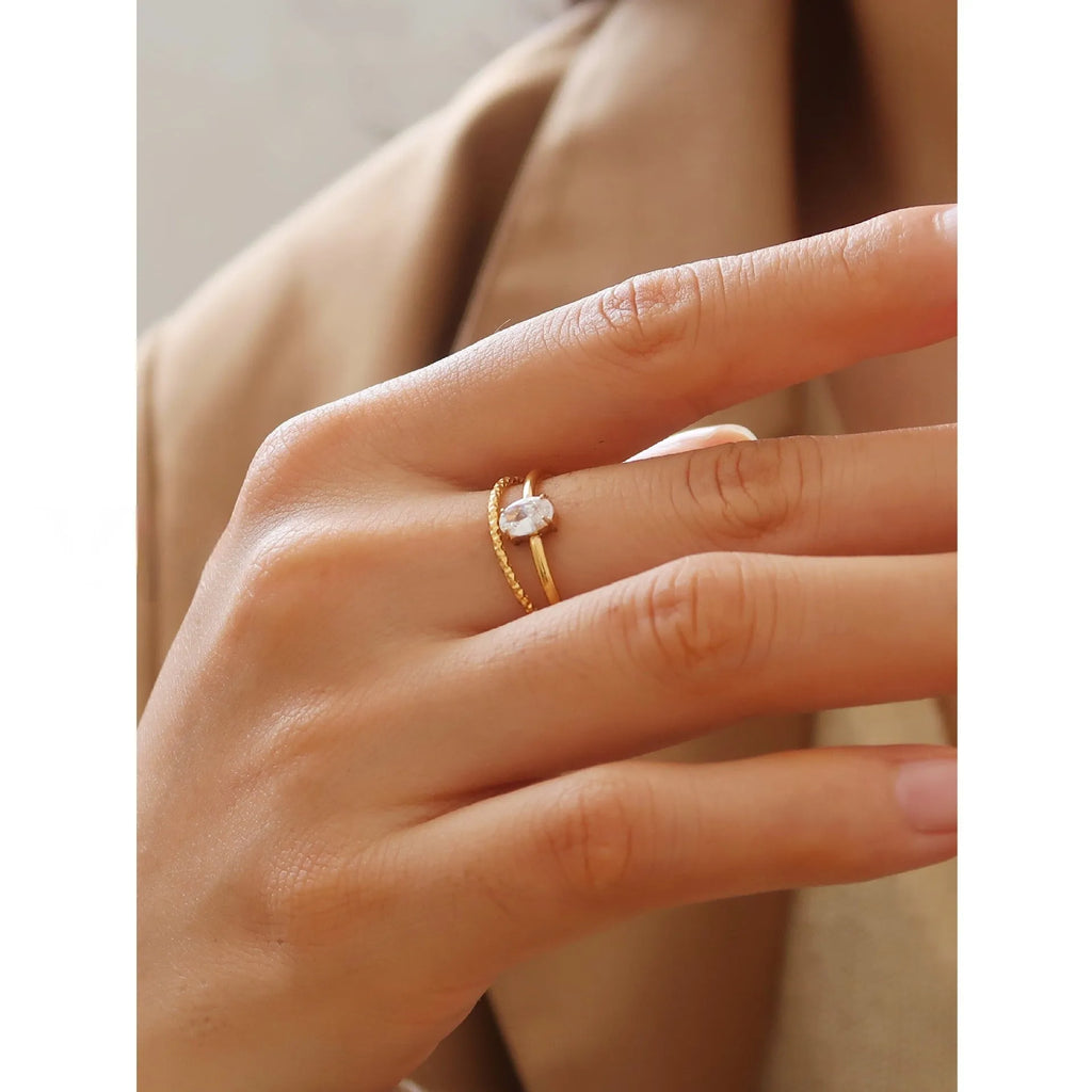 Golden electroplated stainless steel love heart ring for women showing heart shape.